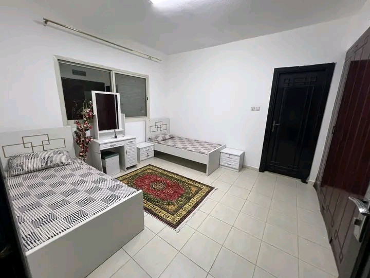 First tenant opens a room in a clean and organized girls' apartment