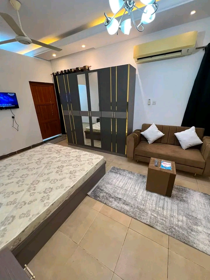 First tenant: Studio apartment with one room, bathroom, and kitchen