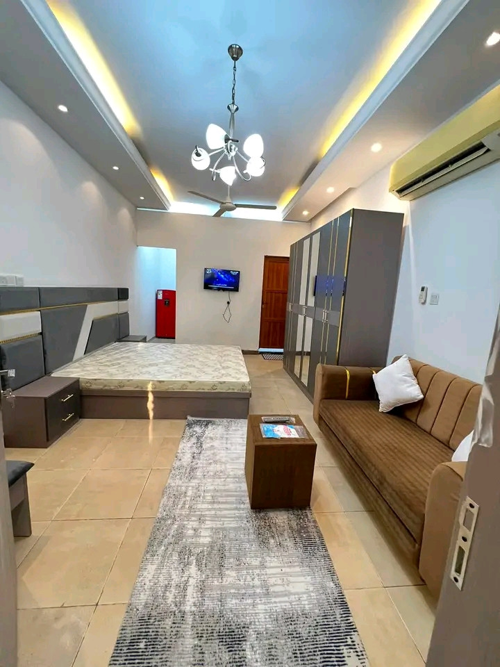 First tenant: Studio apartment with one room, bathroom, and kitchen