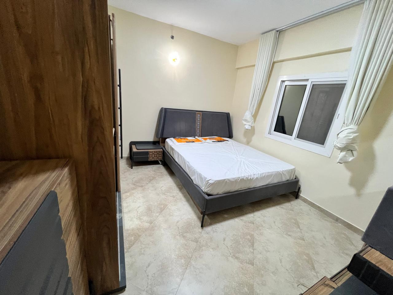 First tenant, one bedroom and living room with balcony