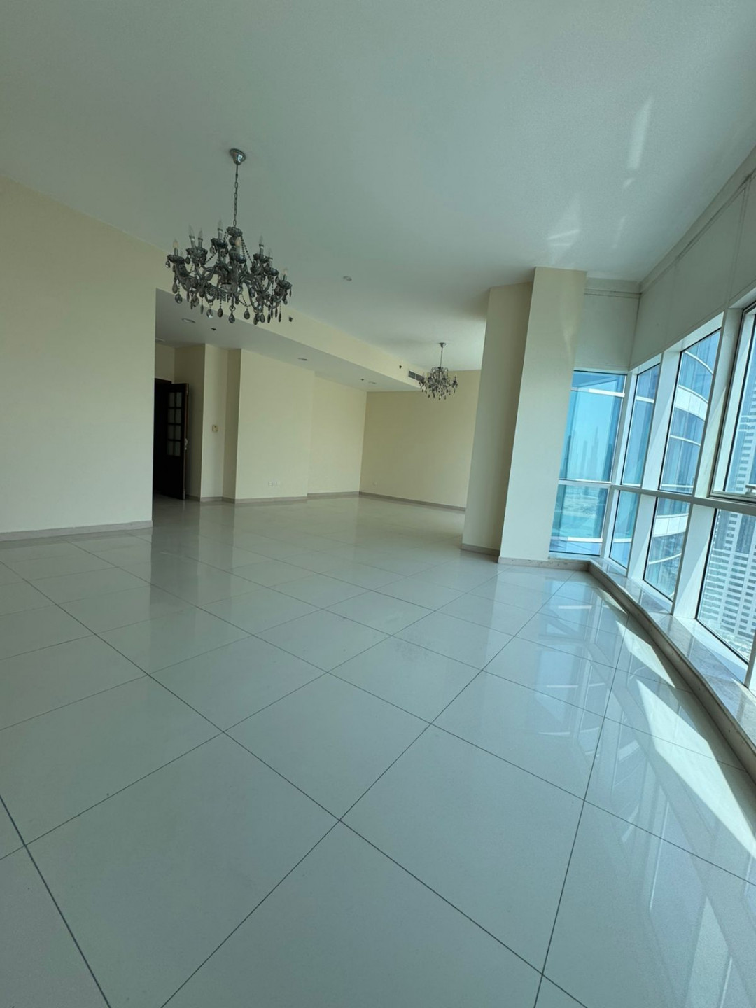 The finest three-bedroom apartment with a living room in the Al Khan area of Sharjah, with a sea view.