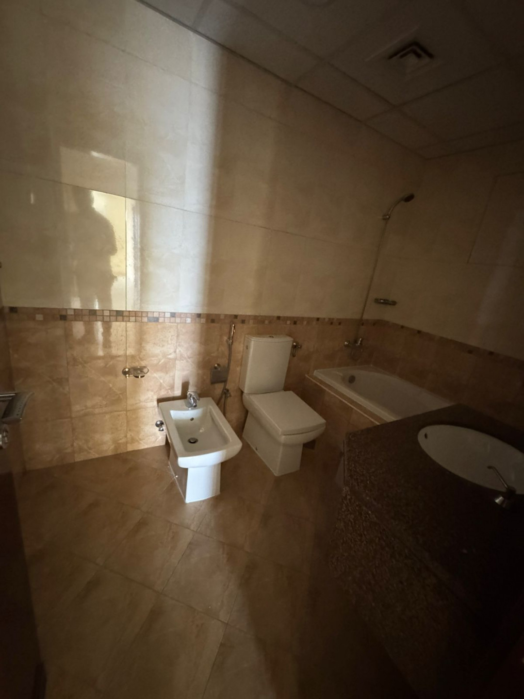 The finest three-bedroom apartment with a living room in the Al Khan area of Sharjah, with a sea view.