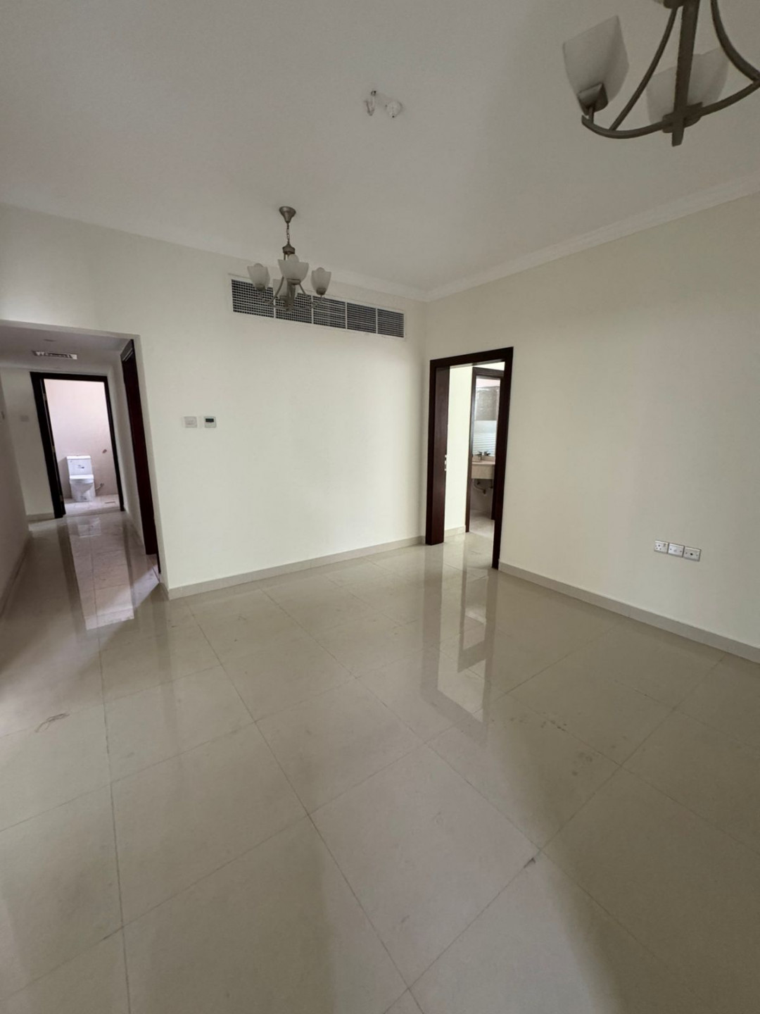 The most stylish and largest two-bedroom and two-living room apartment in Al Khan, Sharjah, with a garden, KidZaria, and parking.