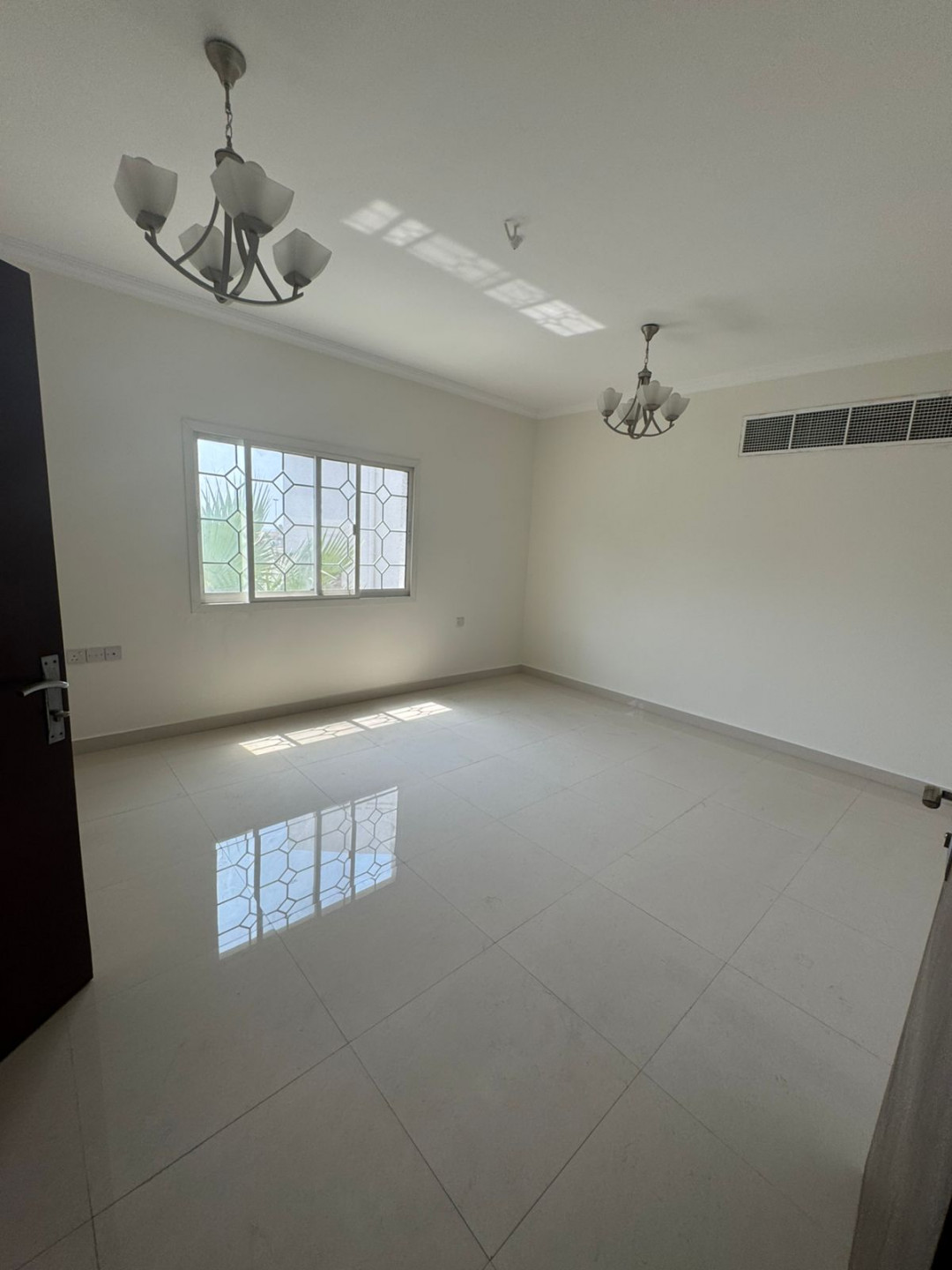 The most stylish and largest two-bedroom and two-living room apartment in Al Khan, Sharjah, with a garden, KidZaria, and parking.
