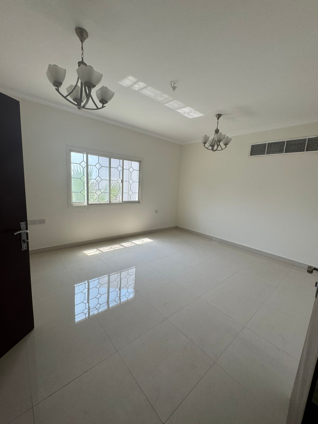 The most stylish and largest two-bedroom and two-living room apartment in Al Khan, Sharjah, with a garden, KidZaria, and parking.