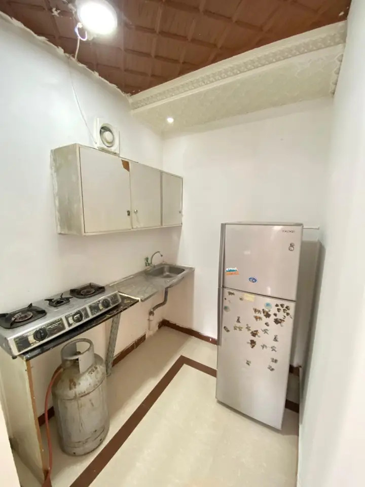Studio apartment with one room, bathroom, and standard kitchen