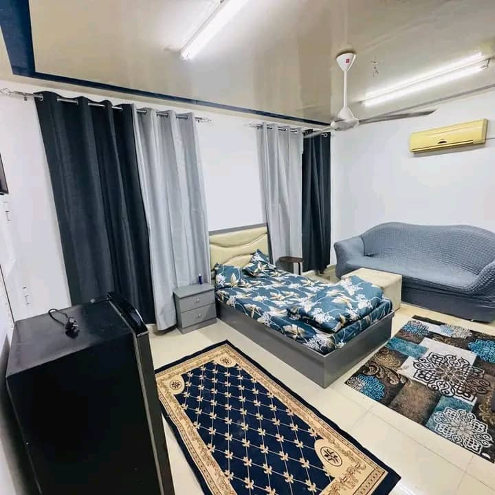 Studio apartment with a bedroom and bathroom, furnished with new furniture.