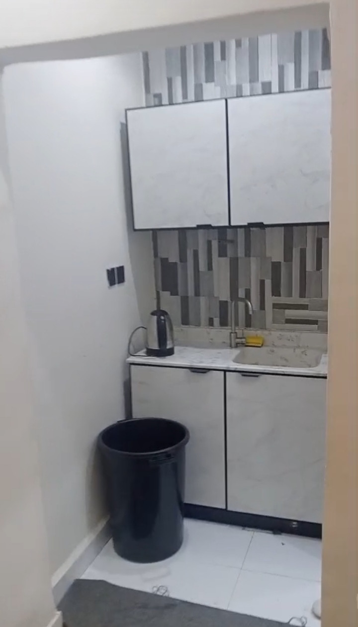 Studio apartment with room, bathroom, and furnished kitchen