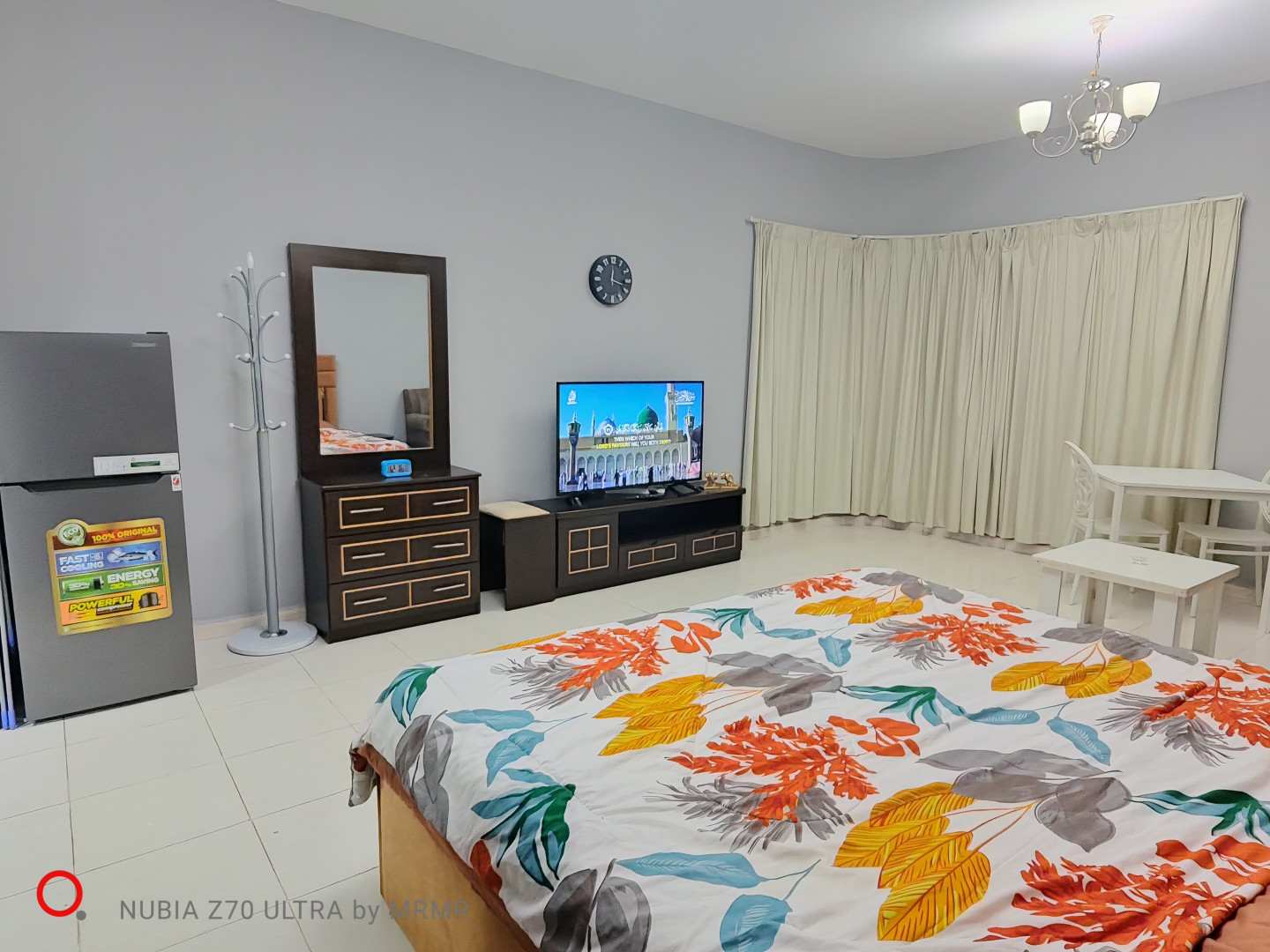 Furnished studio with hotel-style furniture and an open view.