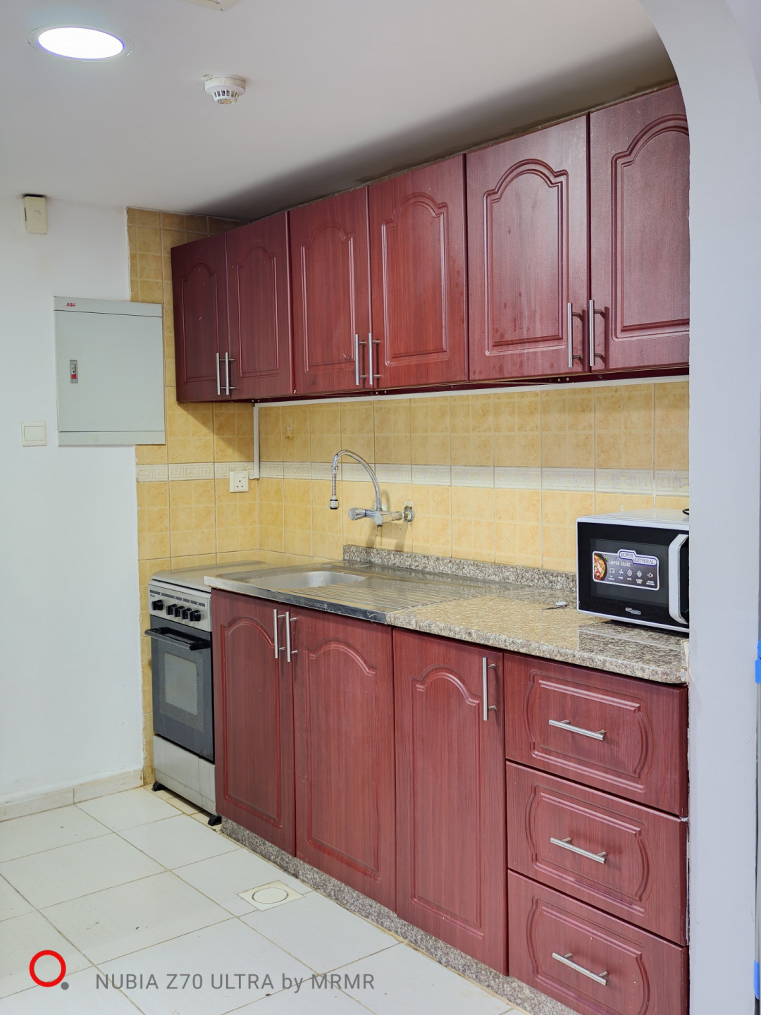 Furnished studio with hotel-style furniture and an open view.