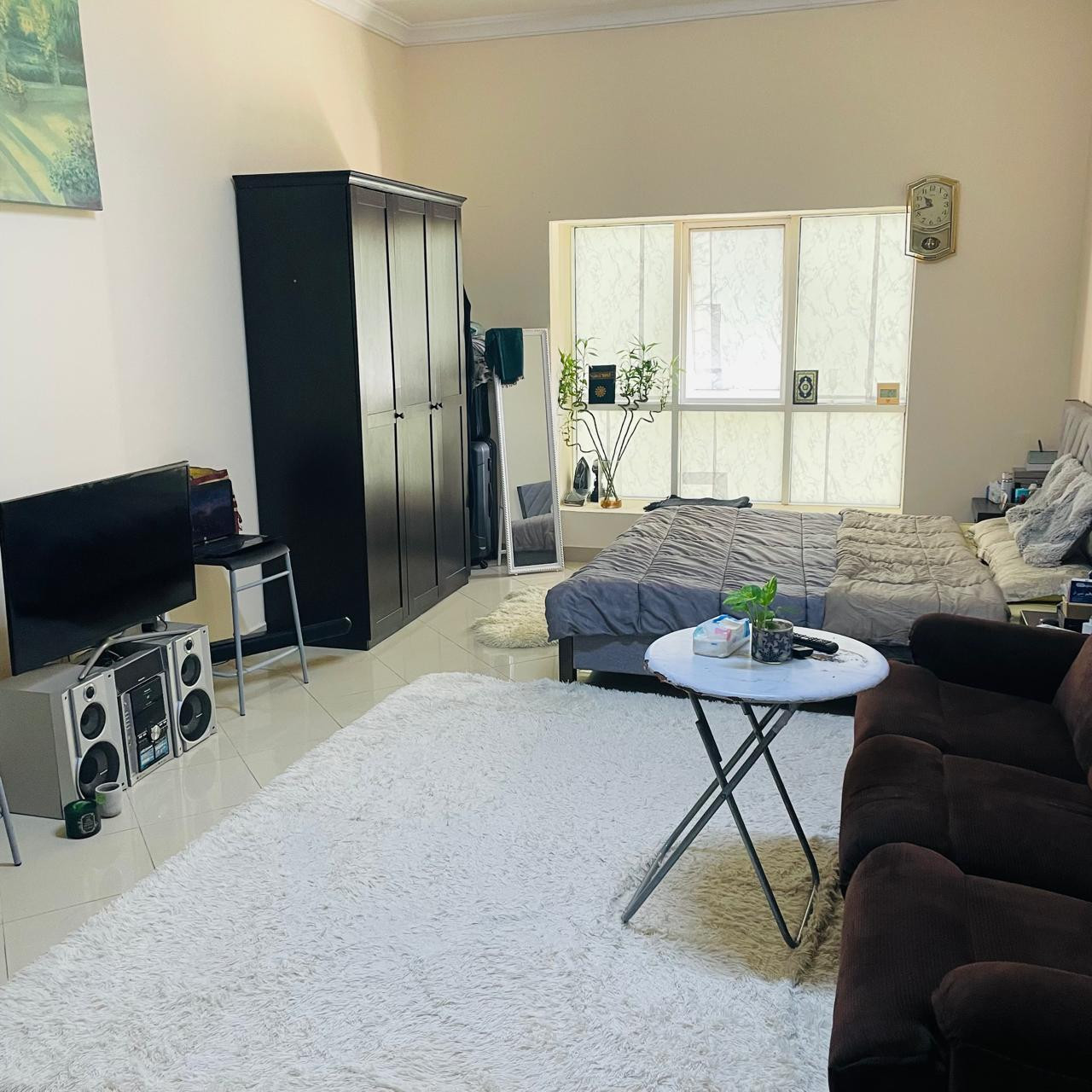 Furnished studio apartment with clean furnishings and ample space in a family building in Al Nasiriyah, Sharjah