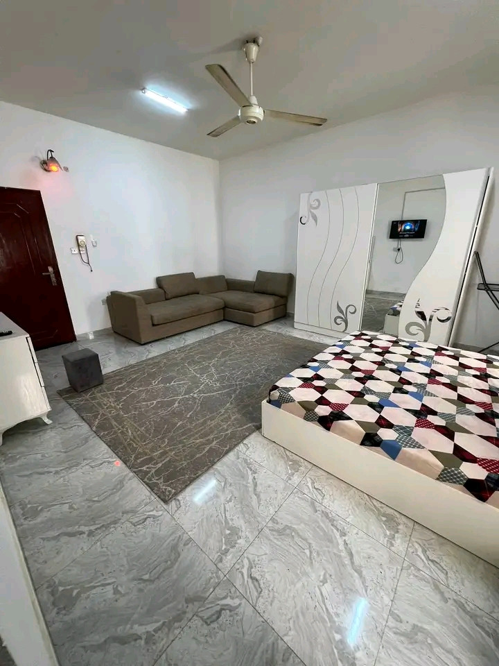 Studio room, bathroom, and kitchen