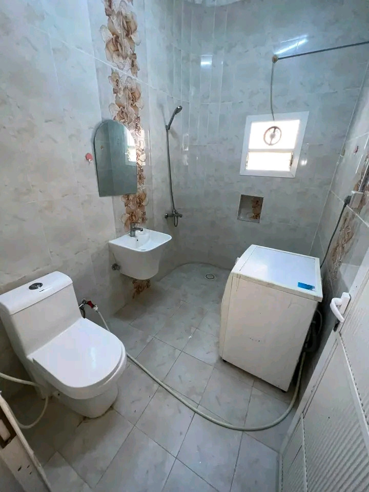 Studio room, bathroom, and kitchen