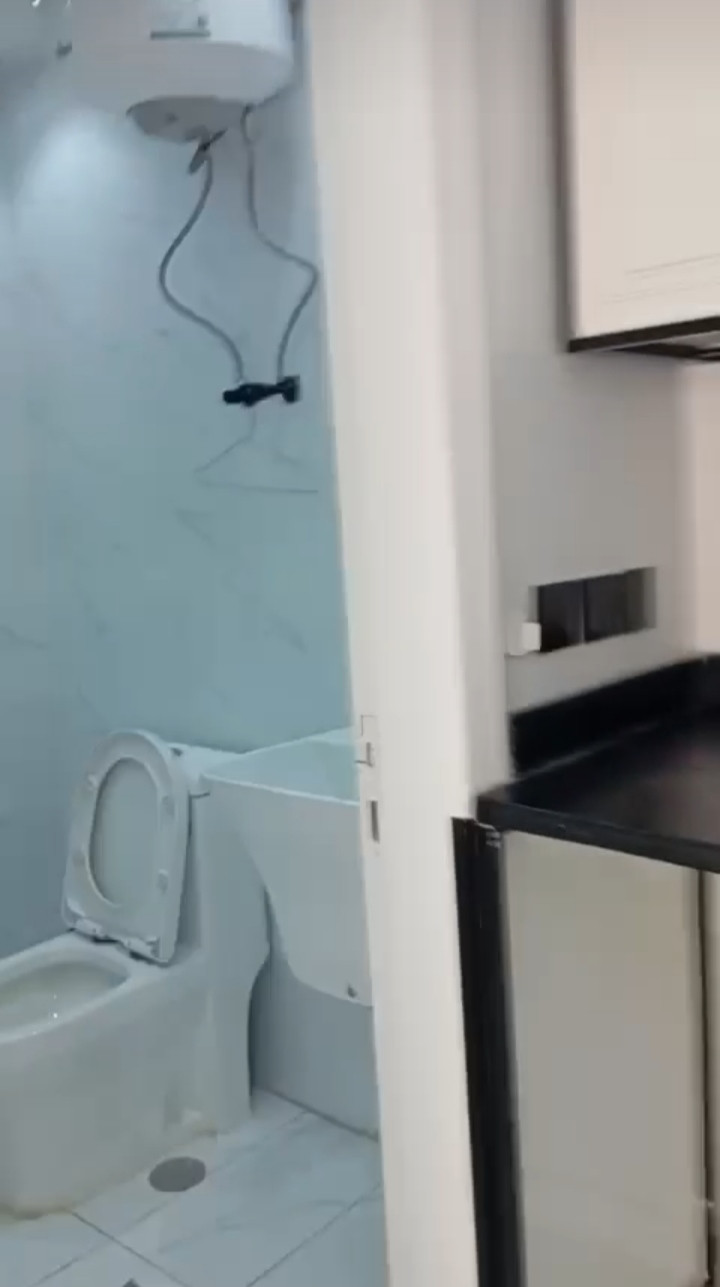 Spacious studio apartment with room, bathroom, and kitchen