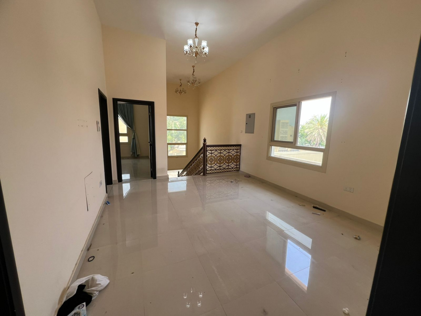 Two-story villa for rent in Al Ghafia, prime location on a main street, 5 master bedrooms and a laundry room