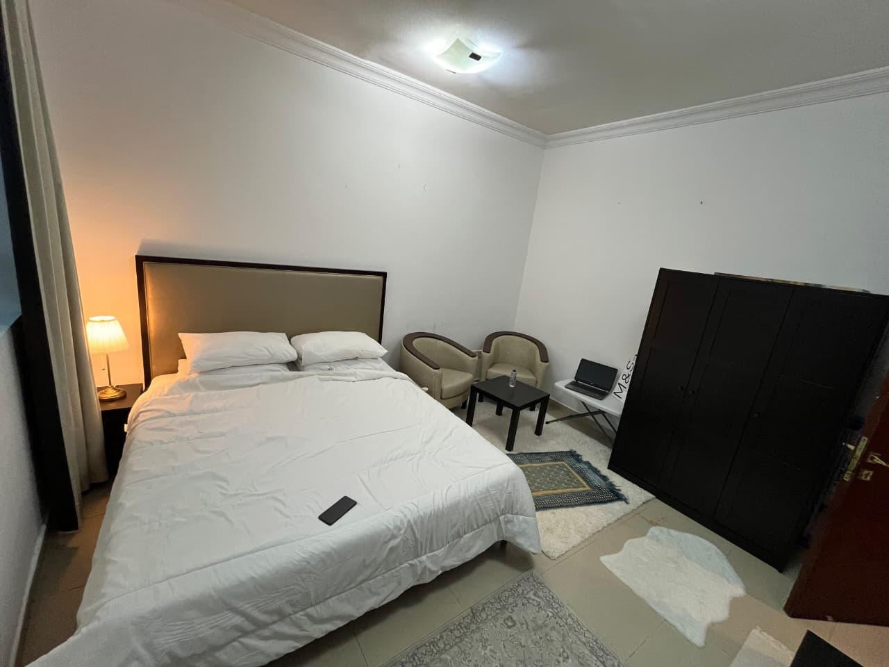Family room in a very clean apartment with a bathroom