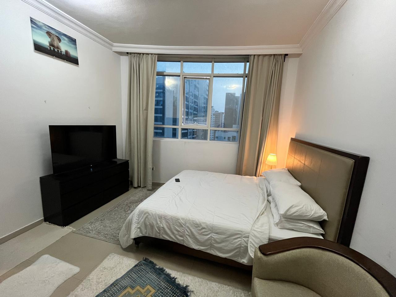 Family room in a very clean apartment with a bathroom