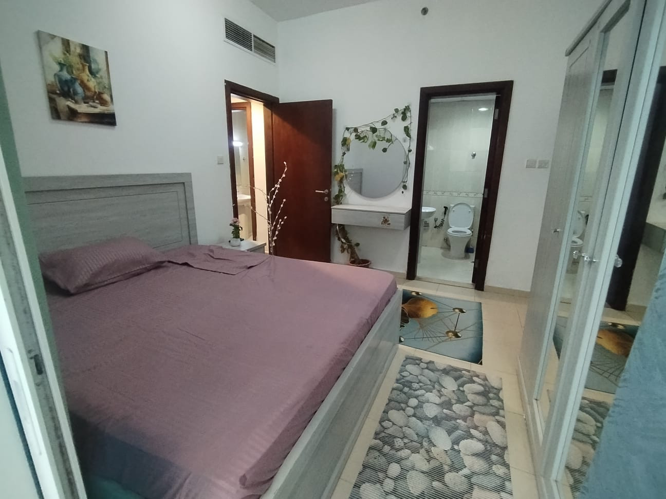 Master bedroom with balcony in a girls' apartment