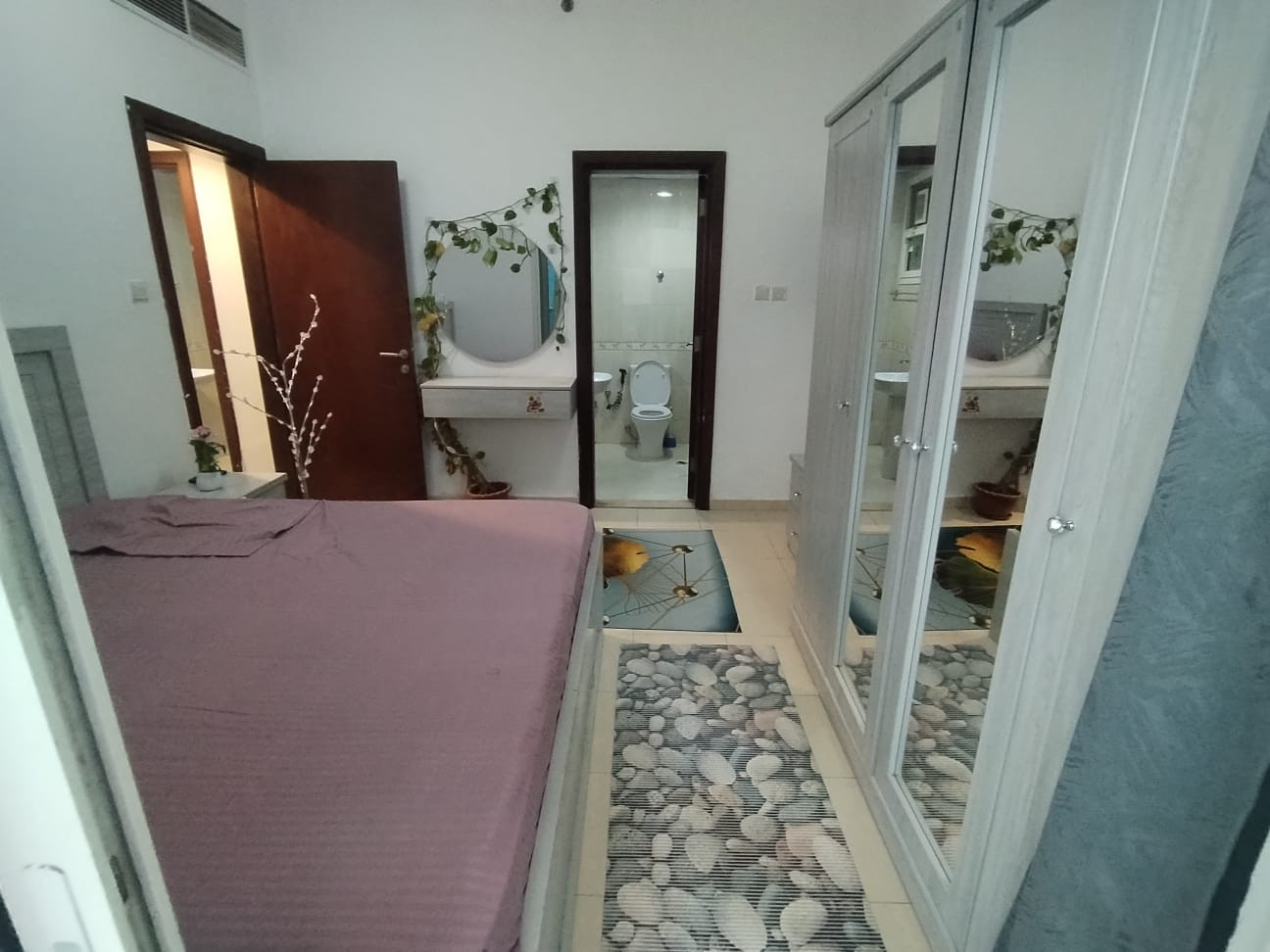 Master bedroom with balcony in a girls' apartment