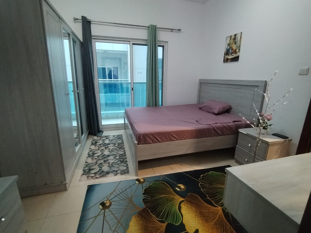 Master bedroom with balcony in a girls' apartment