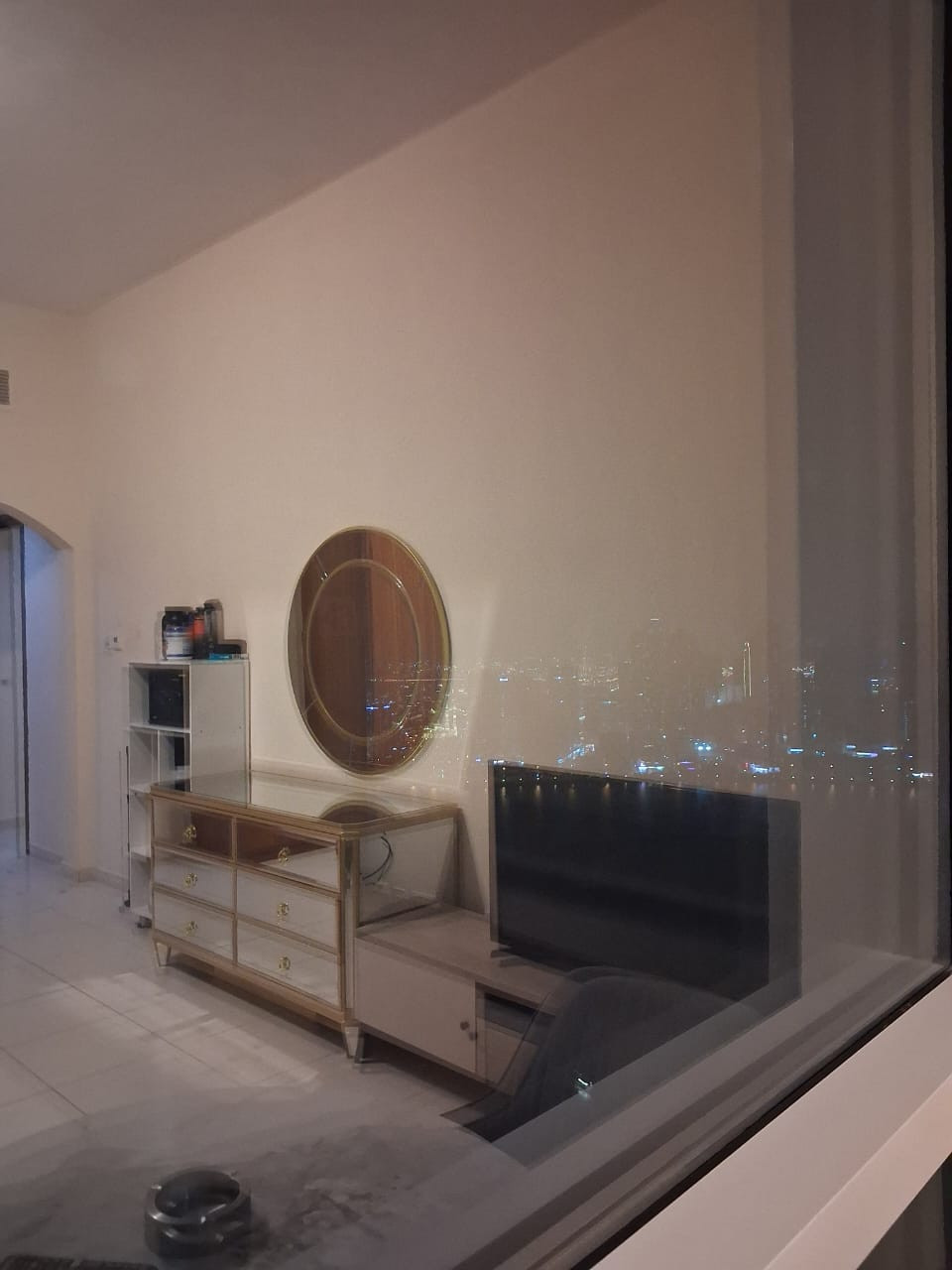 Master bedroom with private bathroom, sofa, and TV