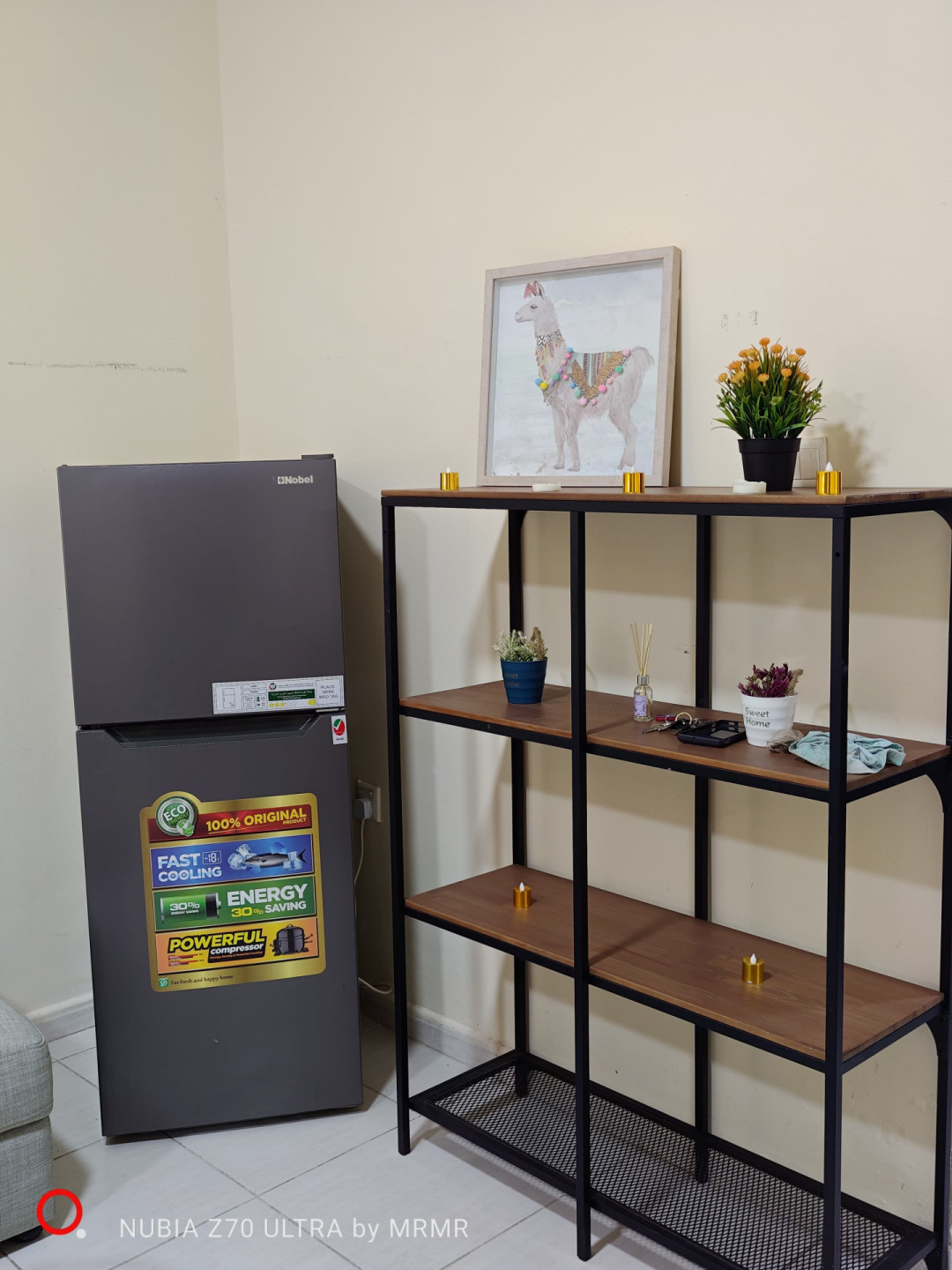 One bedroom and living room furnished with hotel furniture