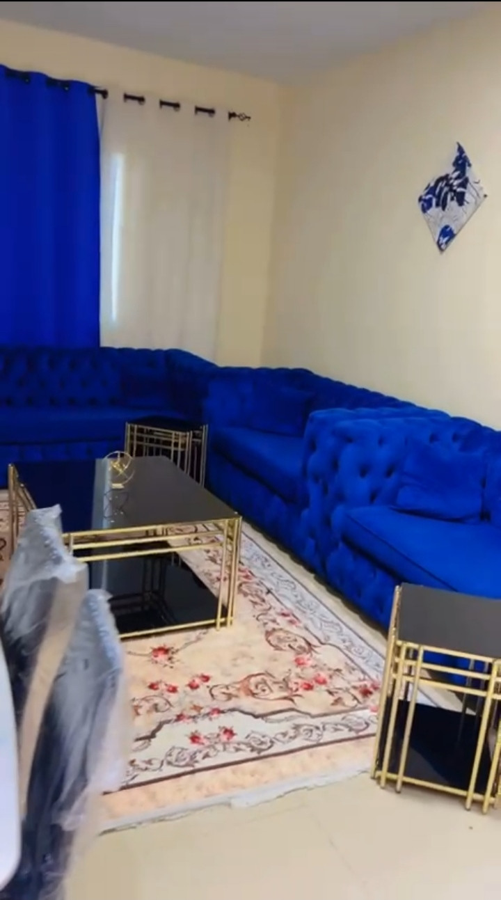 One bedroom and living room, clean furnishings, with an open view.