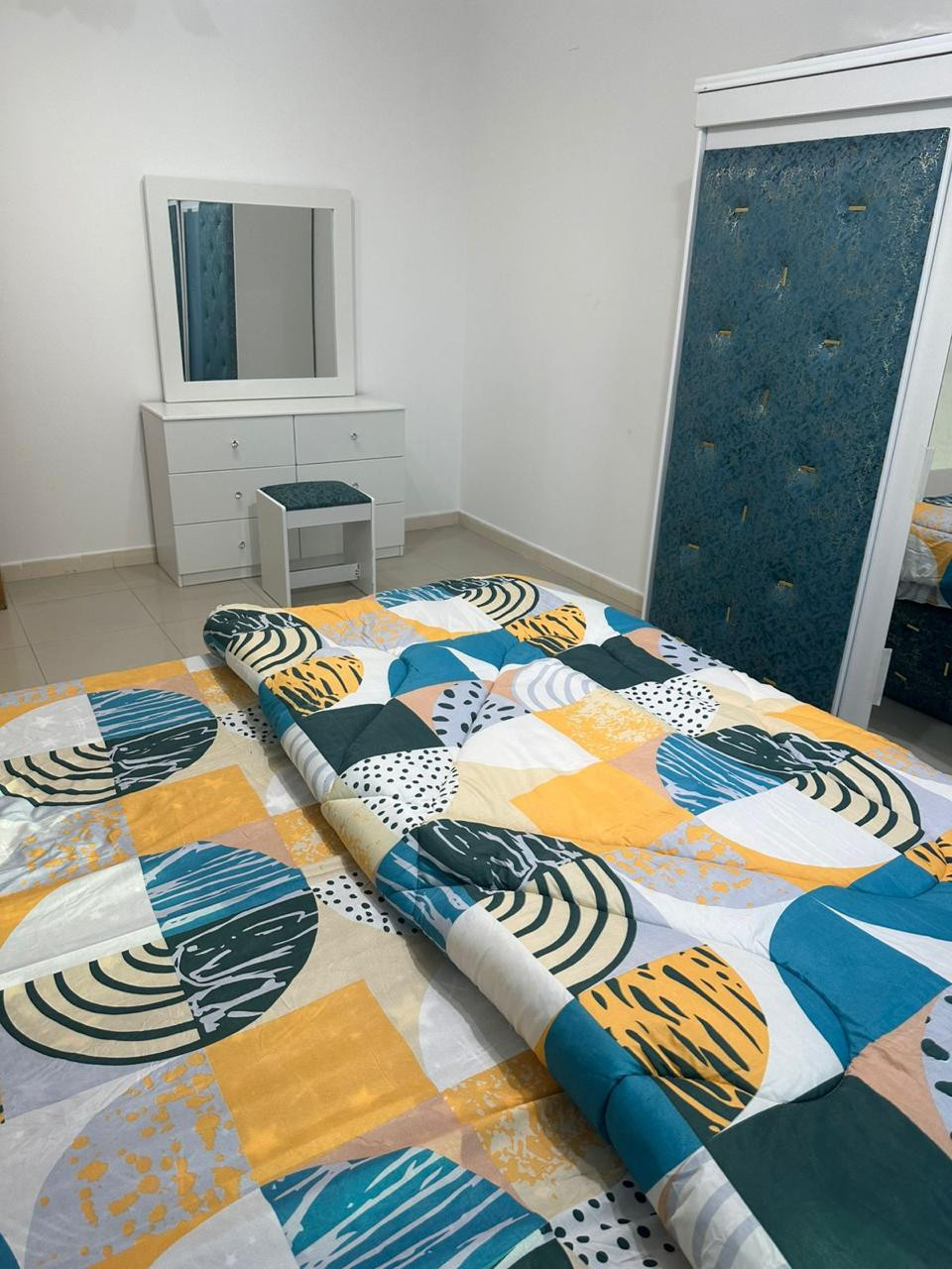 One bedroom and living room, clean furnishings, with a balcony.