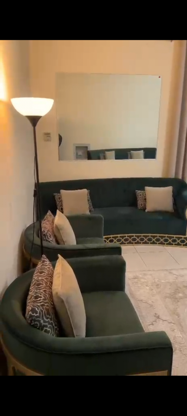 One bedroom and living room furnished with very clean furniture