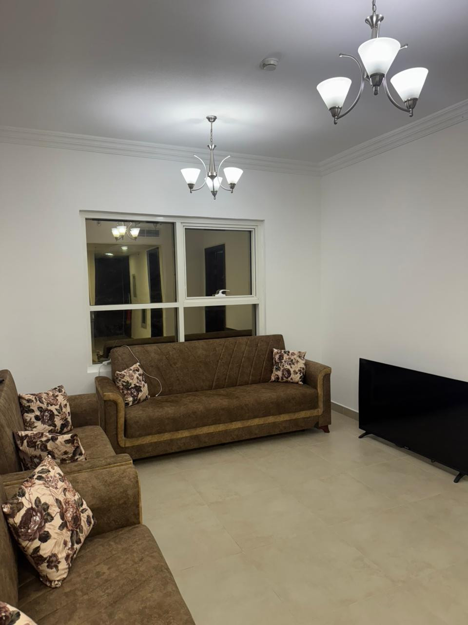 Furnished one-bedroom apartment with clean furnishings in a family building.