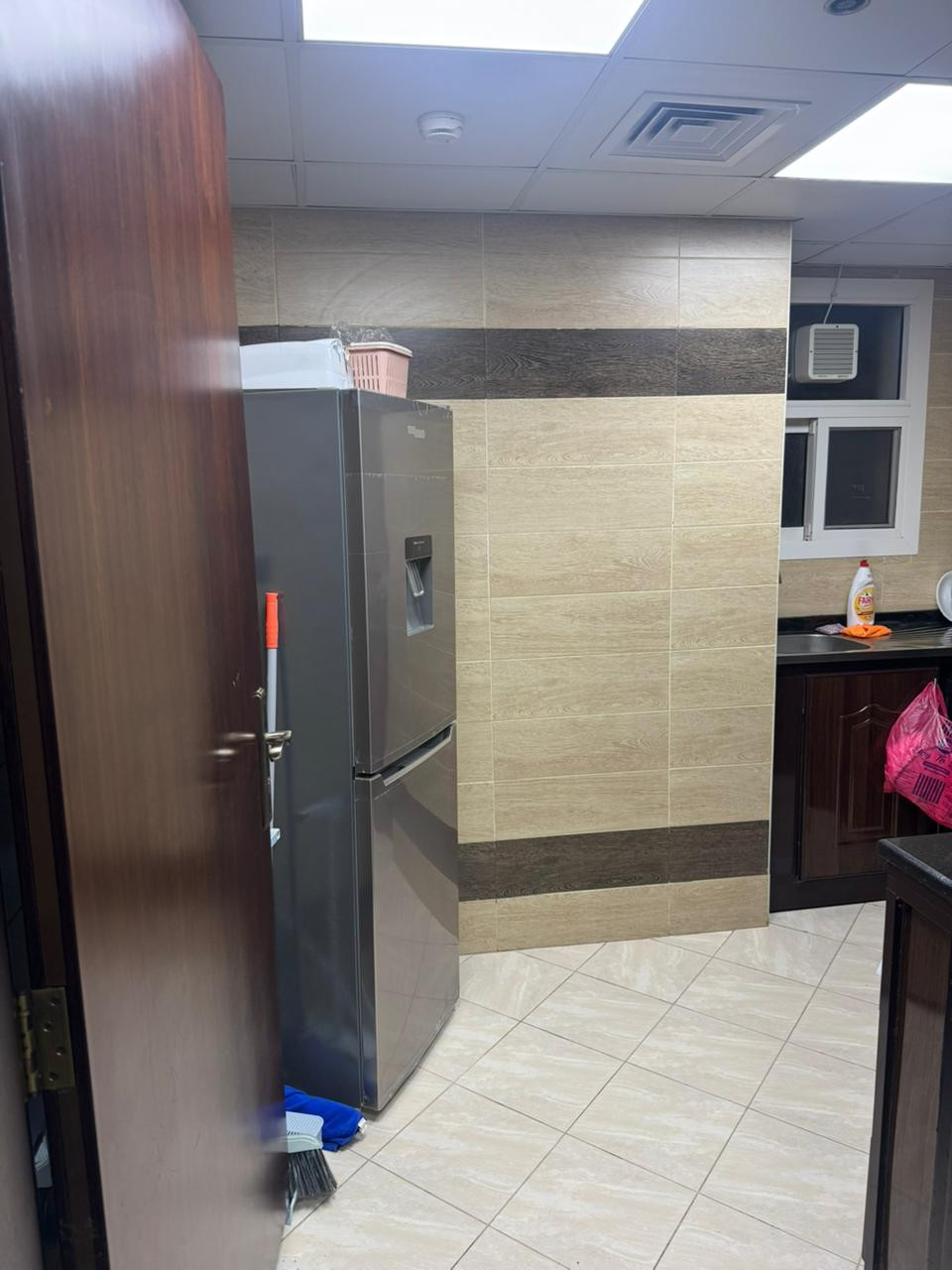 Furnished one-bedroom apartment with clean furnishings in a family building.