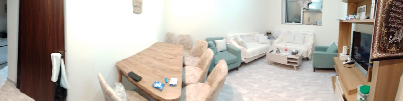 Furnished one bedroom and living room with clean furnishings in Al Taawun