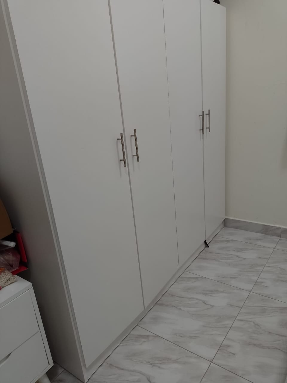 Furnished one bedroom and living room with clean furnishings in Al Taawun