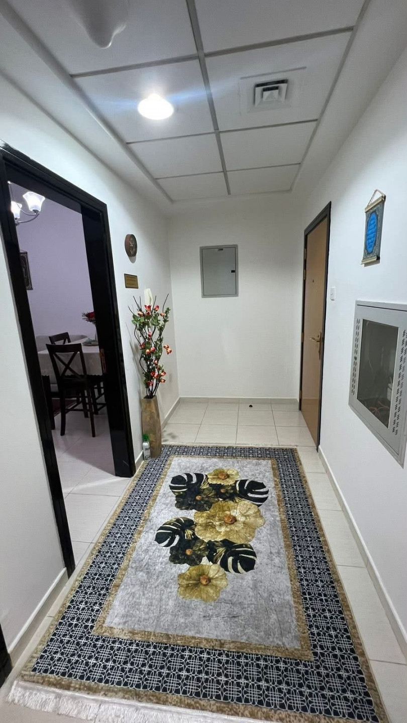 One bedroom and living room furnished with clean furniture in a family building