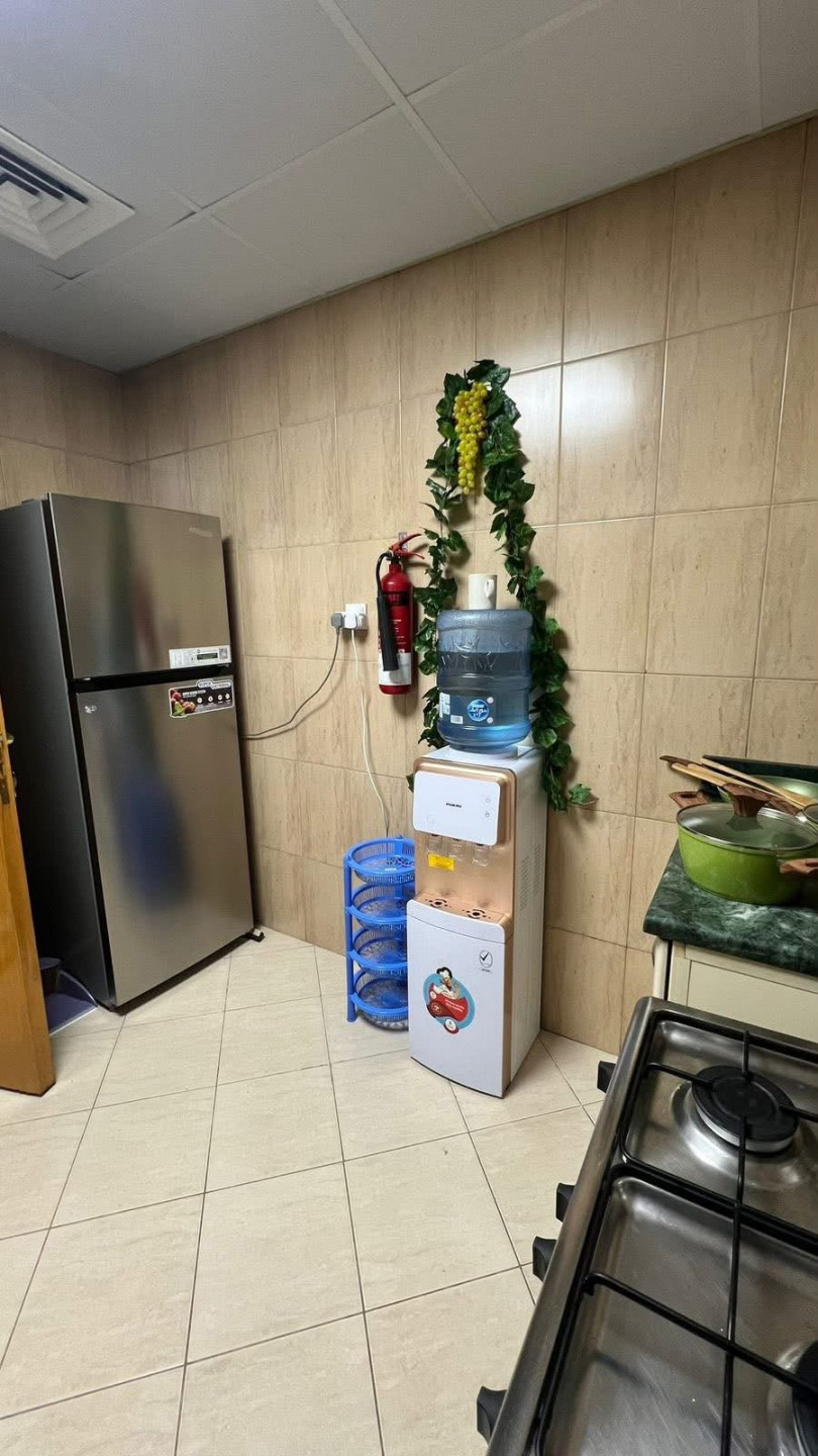 One bedroom and living room furnished with clean furniture in a family building