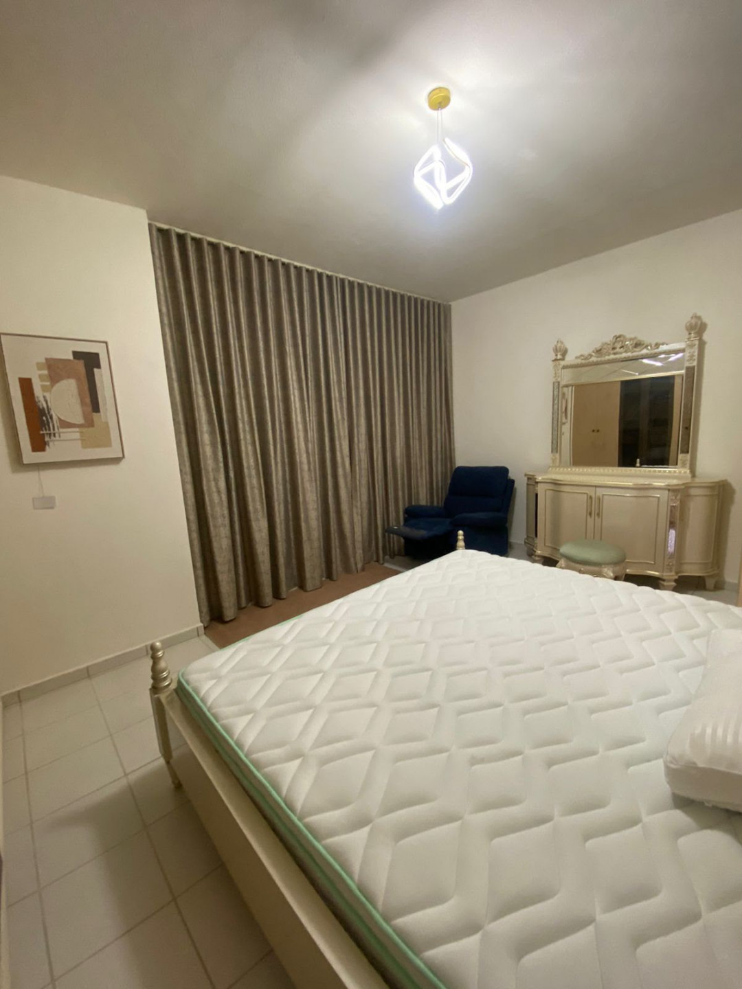 One bedroom and living room furnished with very clean furniture.
