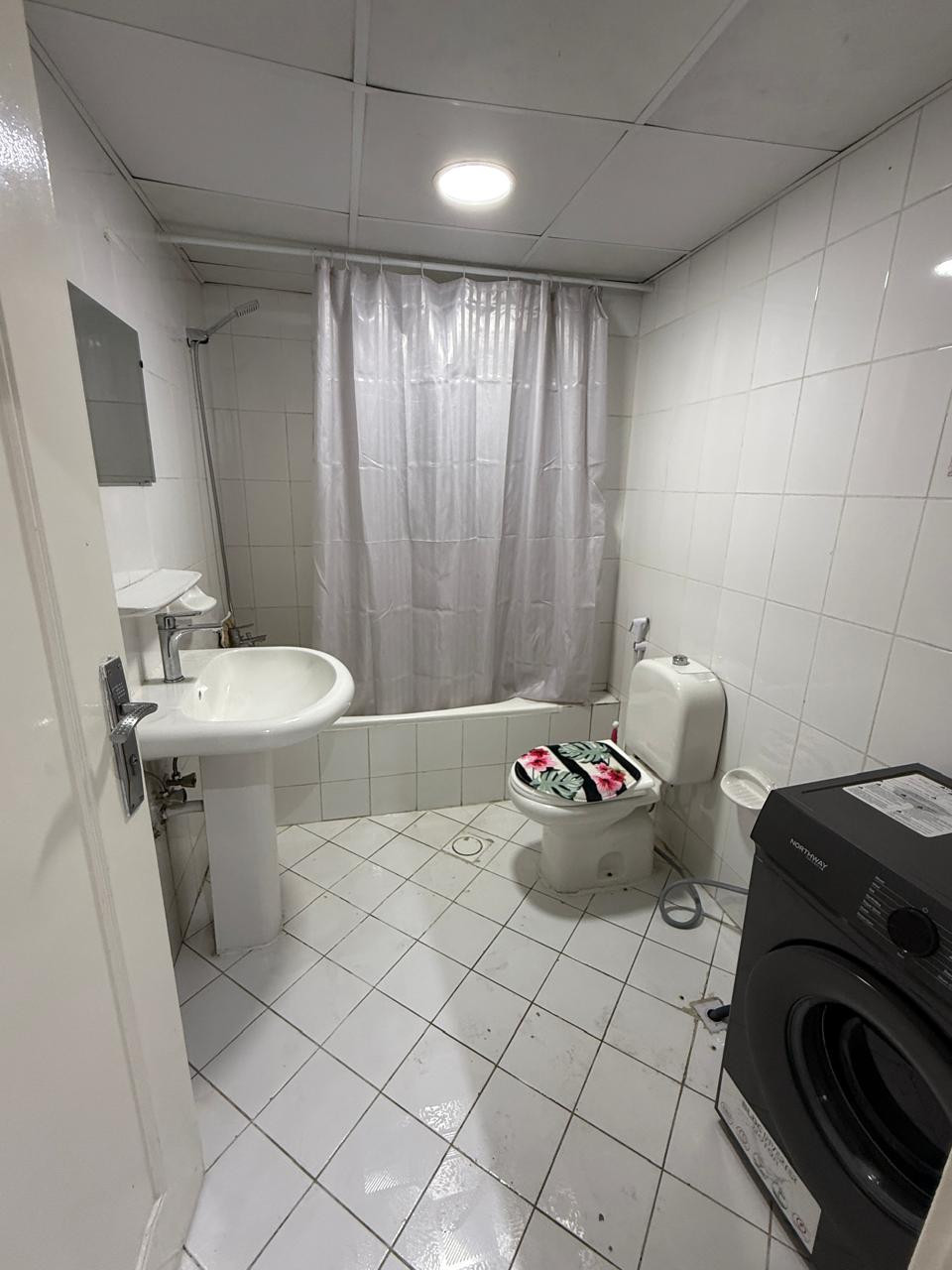 One bedroom and living room furnished with clean furniture and a balcony