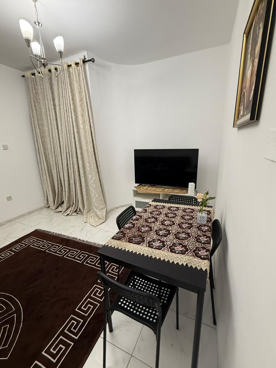 One bedroom and living room furnished with clean furniture and a balcony