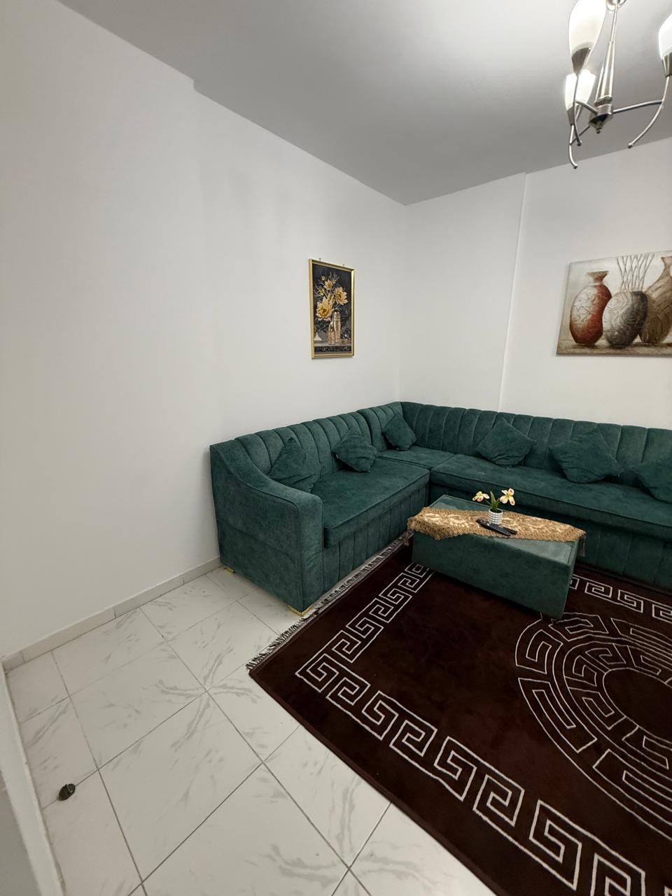 One bedroom and living room furnished with clean furniture and a balcony
