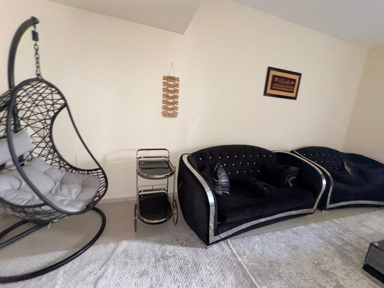 One bedroom and living room furnished with clean furniture and a balcony