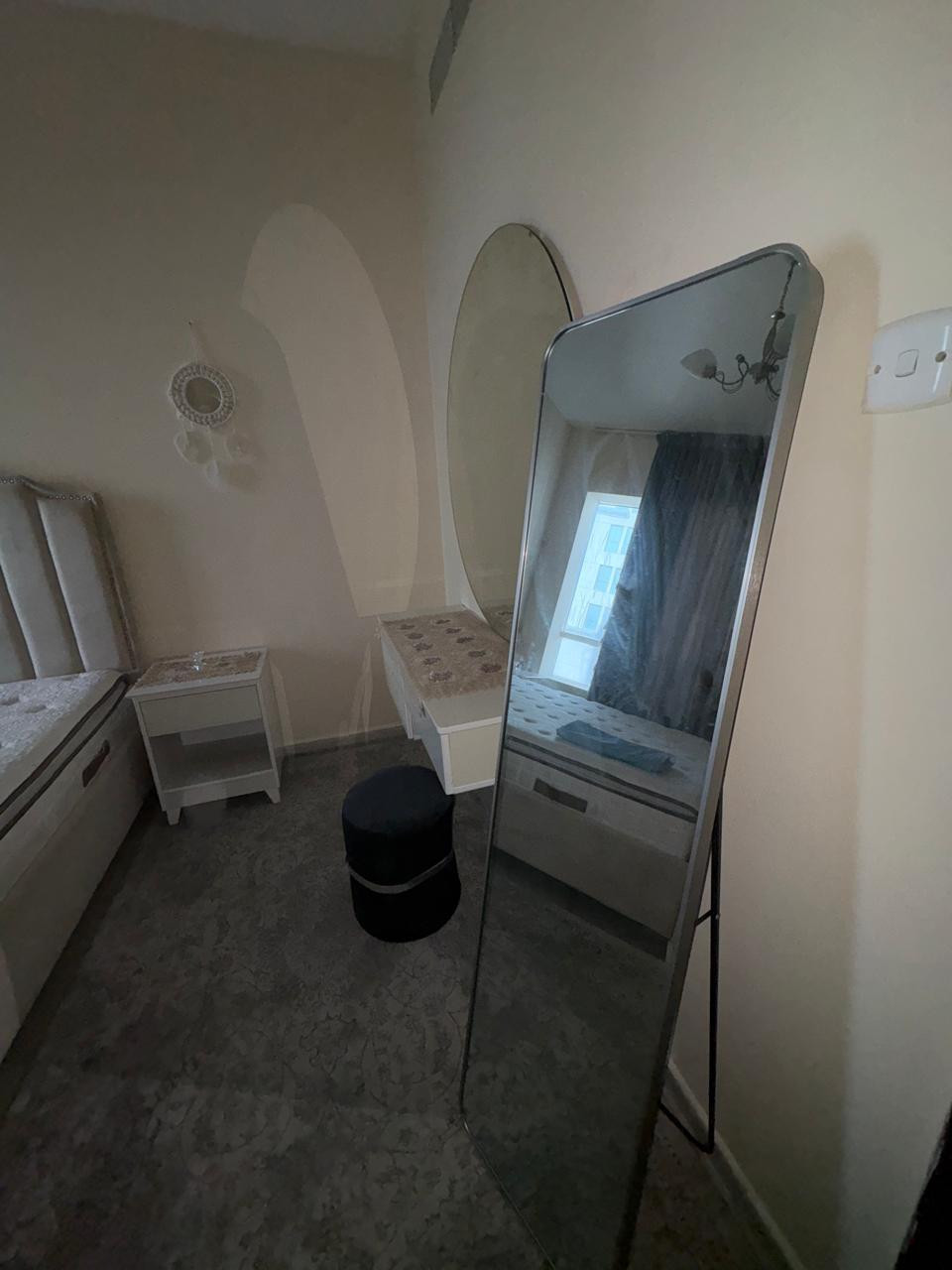 One bedroom and living room furnished with clean furniture and a balcony