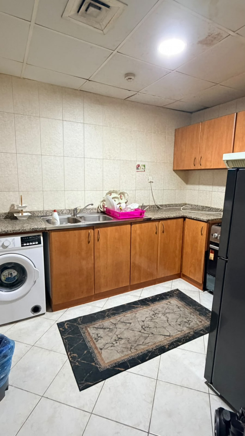 One bedroom and living room furnished with clean furniture and a balcony