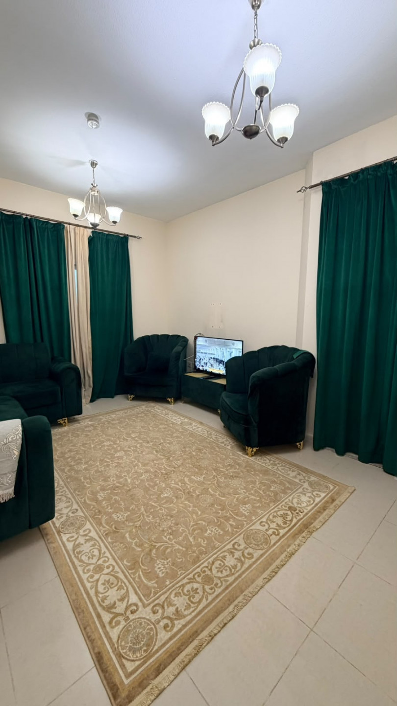 One bedroom and living room furnished with clean furniture and a balcony