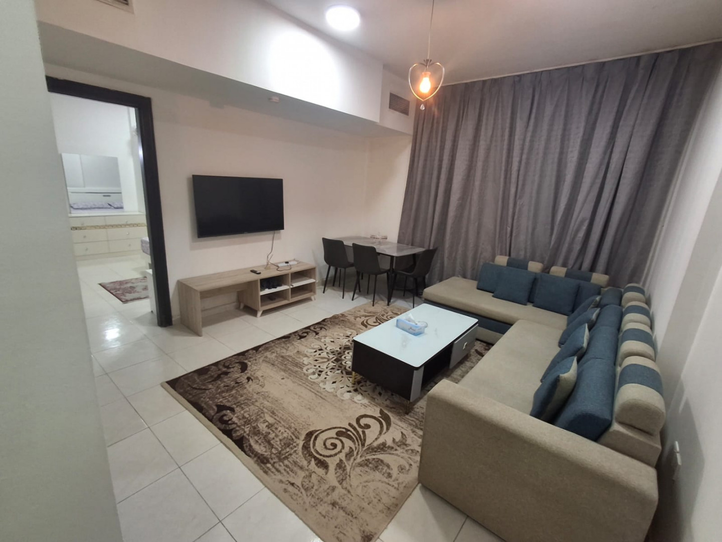 One bedroom and living room furnished with clean furniture and two bathrooms