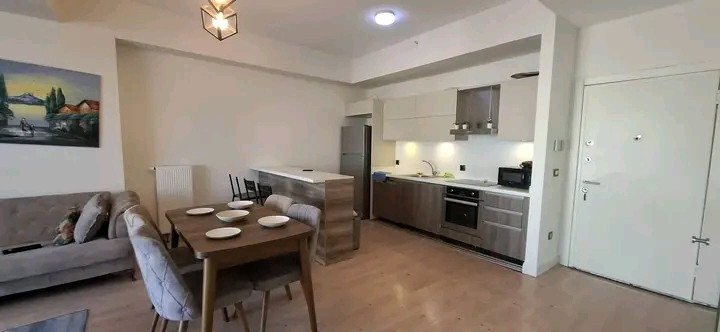 Furnished one-bedroom apartment with air conditioning and a direct view of the mall.
