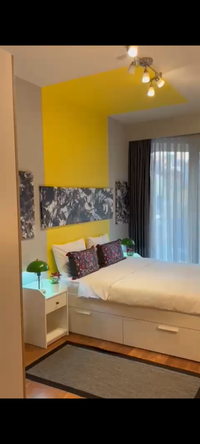 One bedroom and living room within a complex