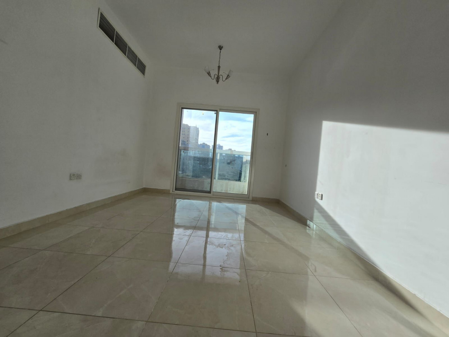 One bedroom and living room for annual rent in Al Jurf 3, Ajman, with excellent space, 2 bathrooms, balcony, open view, easy access to Dubai.