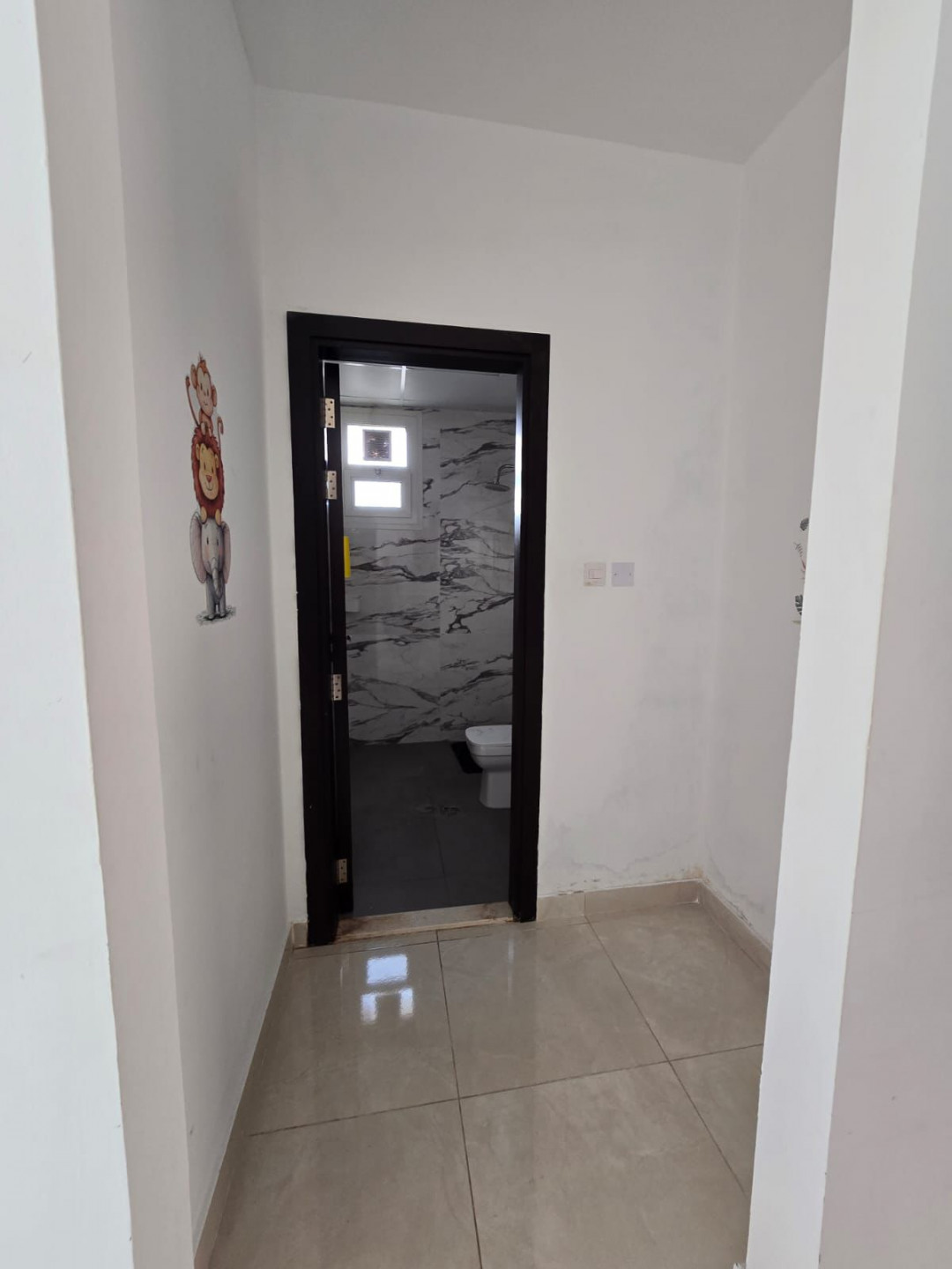 One bedroom and living room for annual rent in Al Jurf 3, Ajman, with excellent space, 2 bathrooms, balcony, open view, easy access to Dubai.