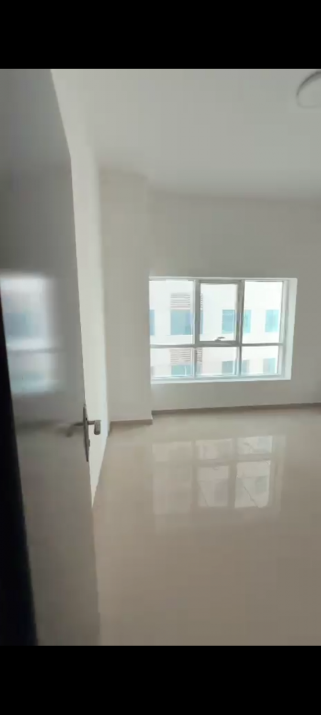 Two bedrooms and a living room in Pearl Towers