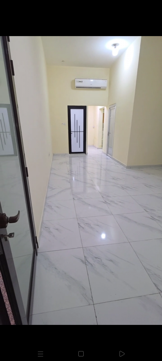 Two bedrooms and a living room in Mohammed Bin Zayed City